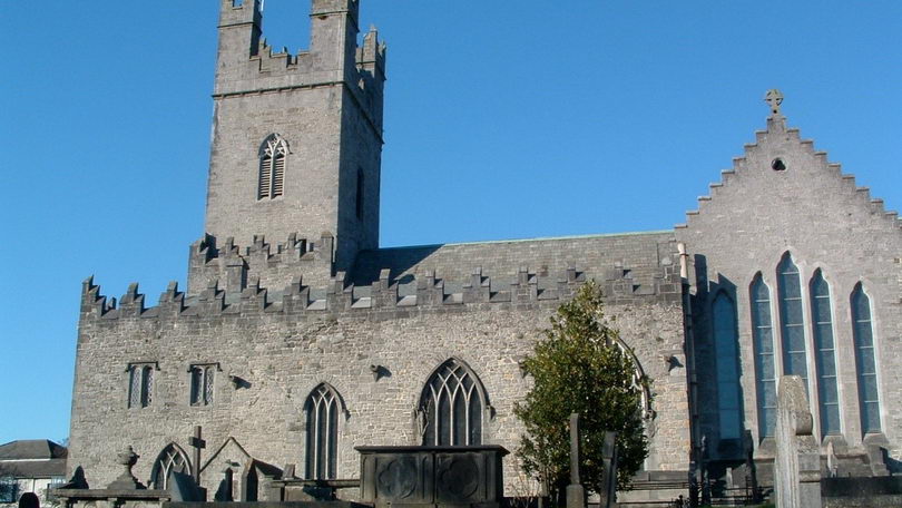 A view of St Mary's Cathedral, Limerick under a clear blue sky