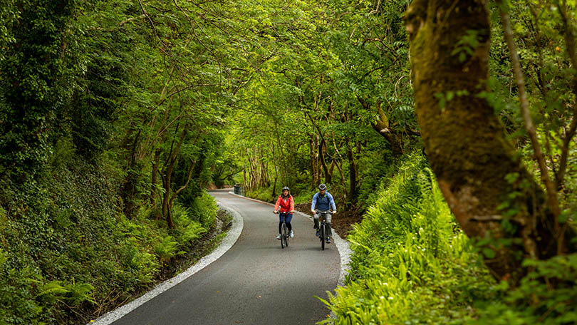 Rachael Conway with Padraig Fogarty at Tullig Wood on the Limerick Greenway. Photo: Seán Curtin, True Media