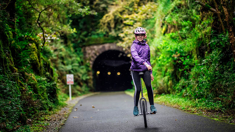 Emma Daly on her unicycle at the Barnagh Tunnell, Limerick Greenway today. Pic. Brian Arthur