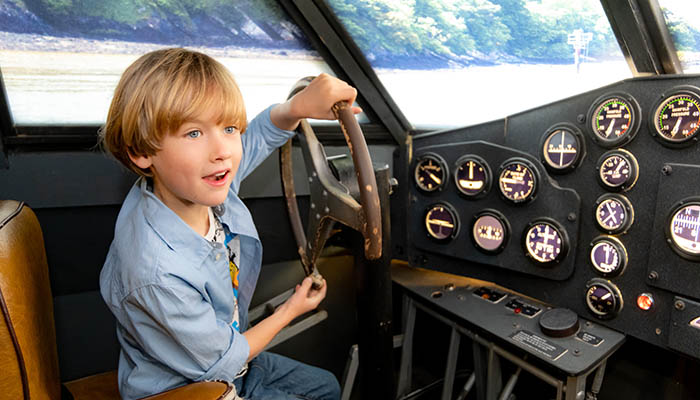Boy playing with flight simulator at Foynes Flying Boat Museum. Photo: Paul Corey