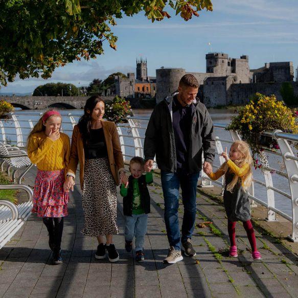 Family walking on the Three Bridges Walk in Limerick